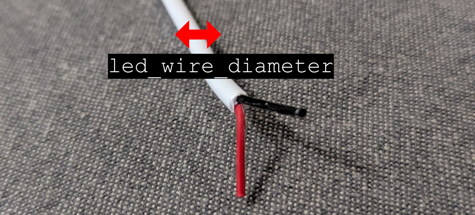 A picture of a wire commonly used to connect LED's. It has a label with the variable dimension.